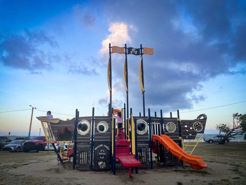 A pirate-themed play structure on a sunny day in Fajardo, Puerto Rico.