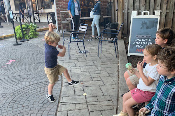 kids playing charades at restaurant with ice cream.jpeg